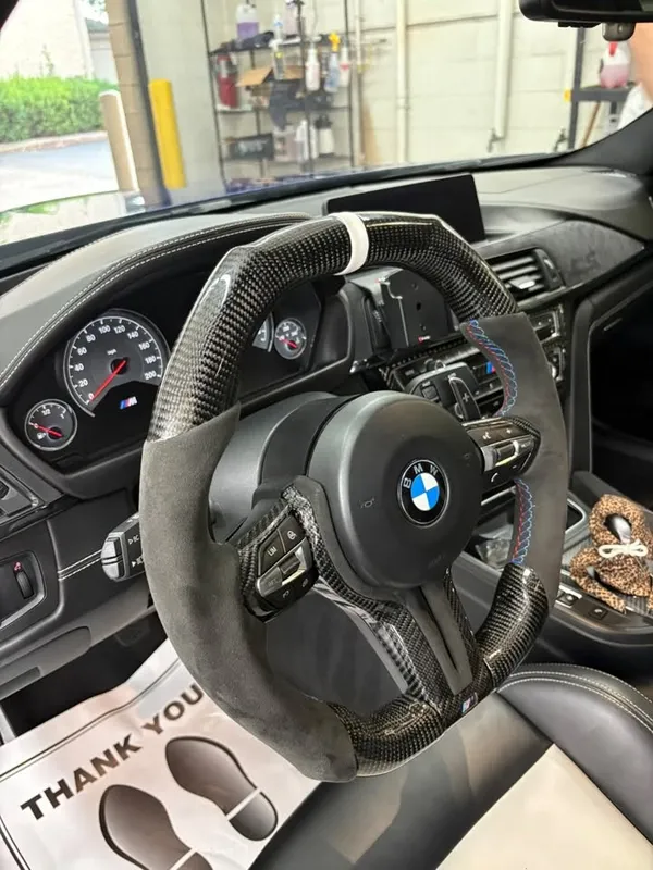 Clean BMW steering wheel dashboard and front cabin