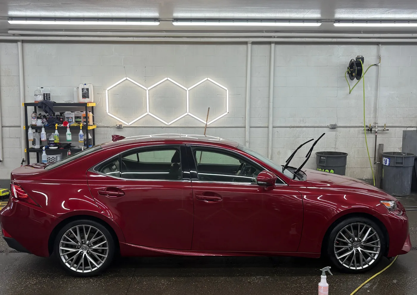 Exterior detail — red Lexus IS sedan with high-gloss polished paint — Powell, Ohio | Touch It Up Automotive