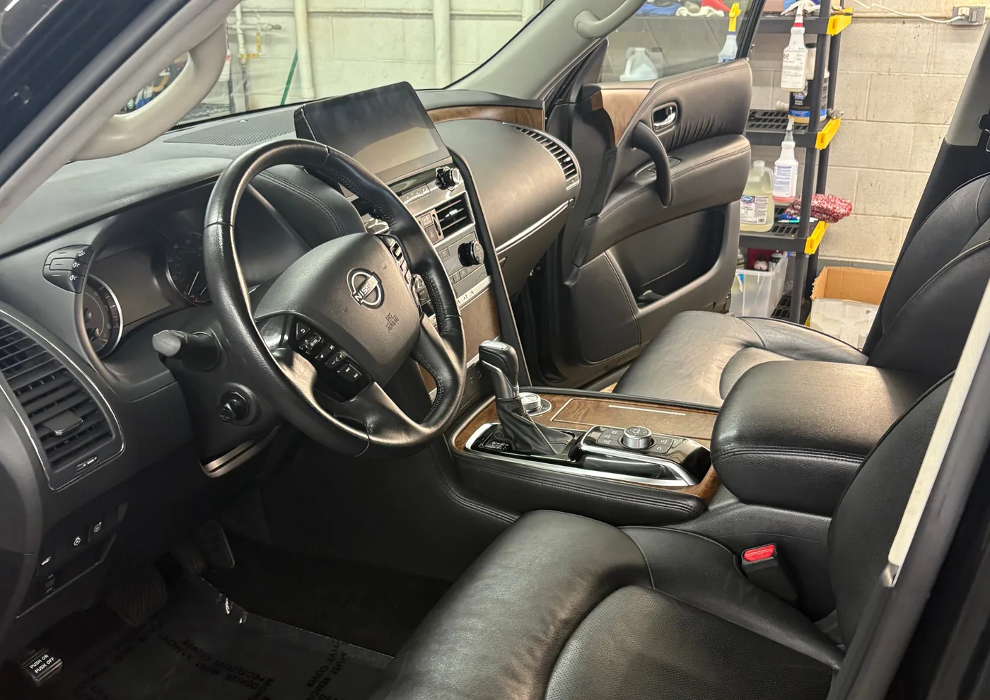 Interior detailing — cleaned and conditioned black leather seating in a Nissan Armada — Hilliard, Ohio | Touch It Up Automotive